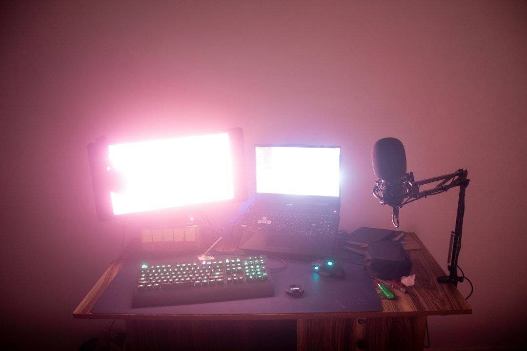 Creator workstation with dual monitors and microphone illustrating a Stream Deck editing and streaming workflow