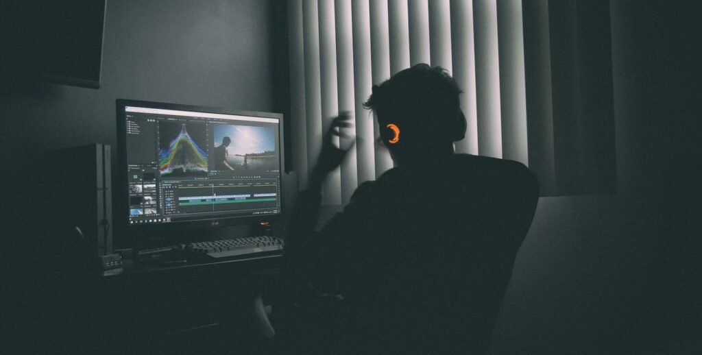 Creator editing video at a desktop workstation